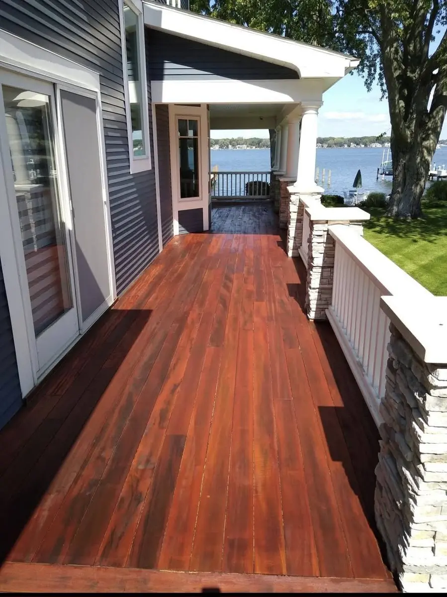 After: porch deck stained a rich reddish brown