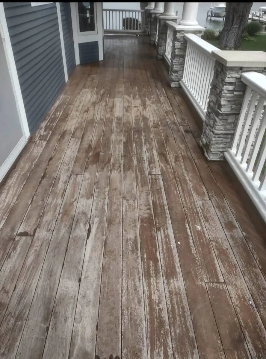 Before: weathered gray porch deck boards