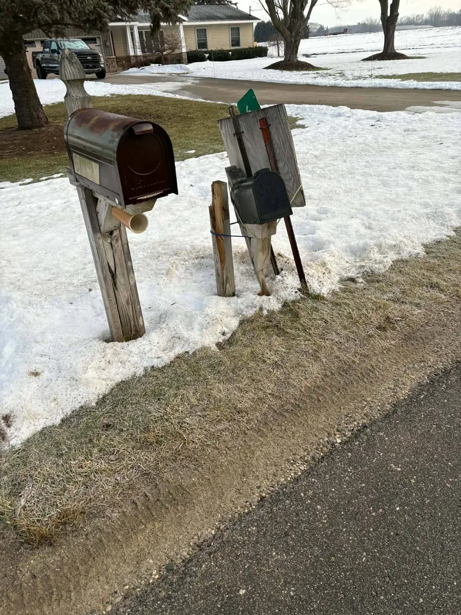 Before: leaning, damaged mailbox post